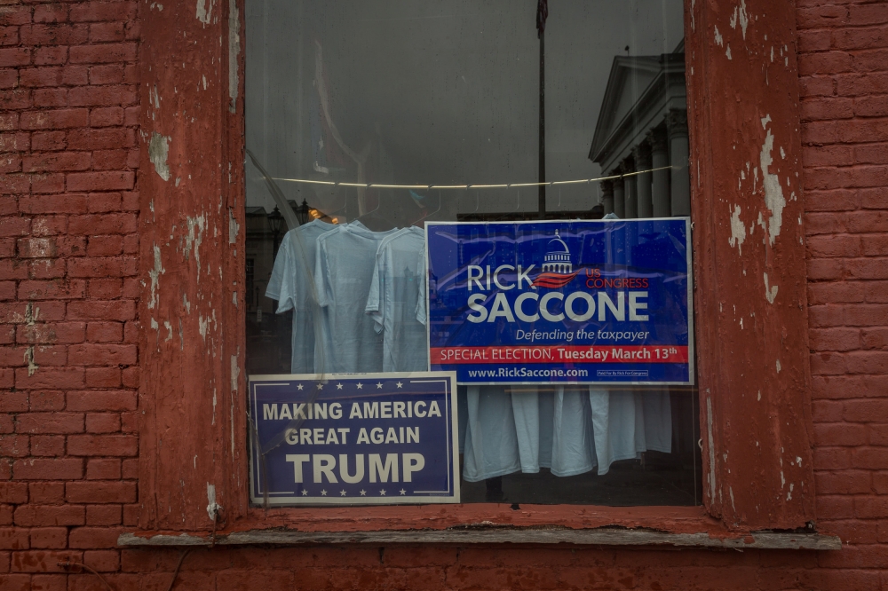 A window announcing support for Congressional candidate Rick Saccone is seen on High Street in Waynesburg, Pennsylvania, US, February 14, 2018. REUTERS/Maranie Staab