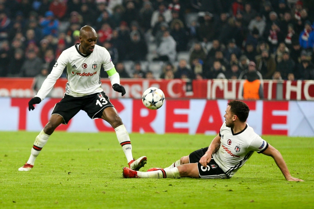 Atiba Hutchinson (L) and Dusko Tosic (R) of Besiktas are seen during the UEFA Champions League Round of 16 soccer match between FC Bayern Munich and Besiktas at the Allianz Arena in Munich, Germany, on February 20, 2018. (Christian Kolbert - Anadolu Agenc