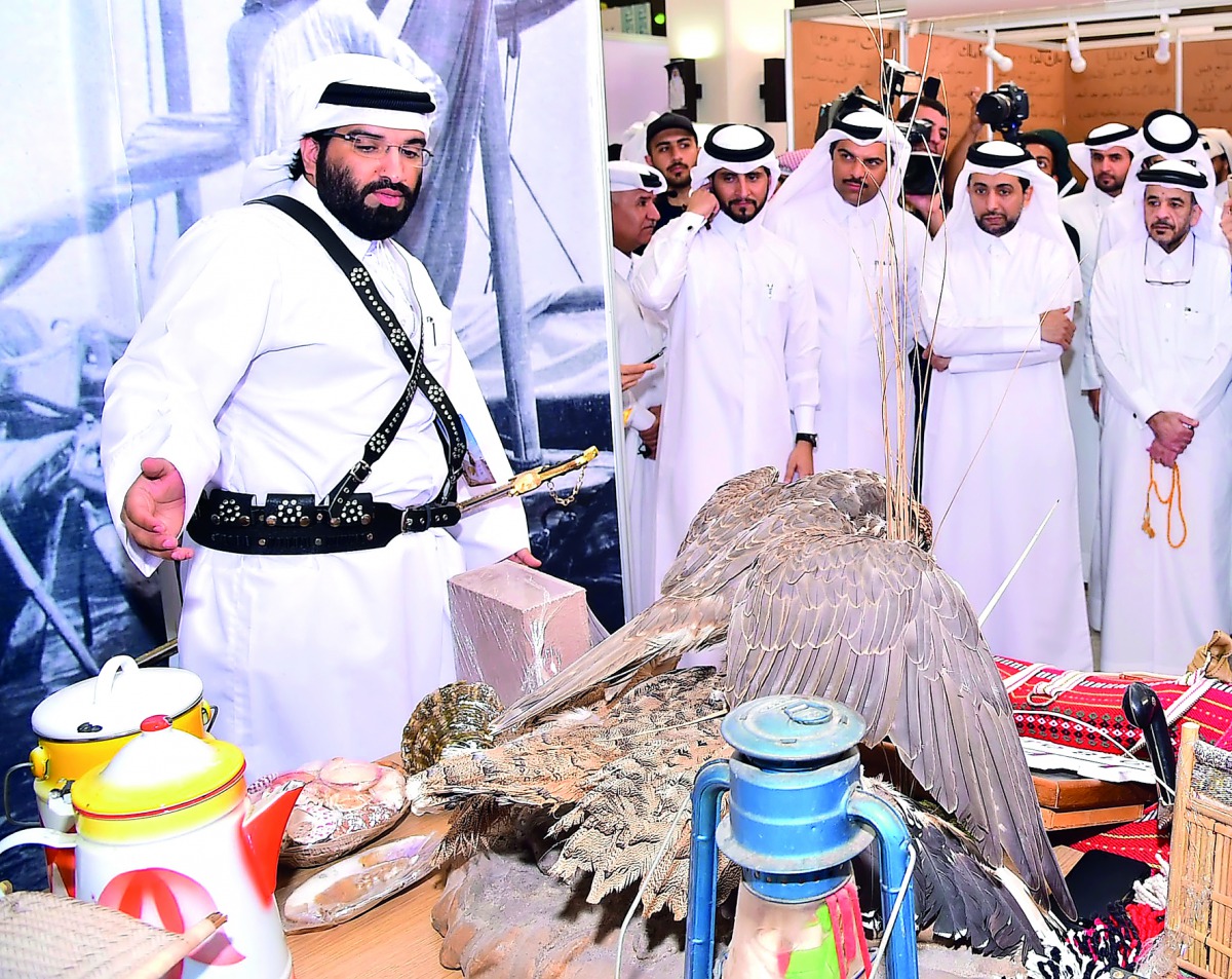 Visitors being briefed on the displays at one of the stalls.