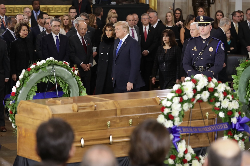 President Donald Trump and first lady Melania Trump participate in a ceremony in the U.S. Capitol Rotunda to honor Christian evangelist and Southern Baptist minister Billy Graham February 28, 2018 in Washington, DC.  Chip Somodevilla/Getty Images/AFP