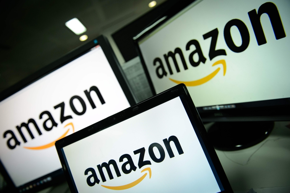 (FILES) In this file photo taken on December 11, 2014 the logo of the online retailer Amazon is displayed on computer screens in London. AFP / LEON NEAL