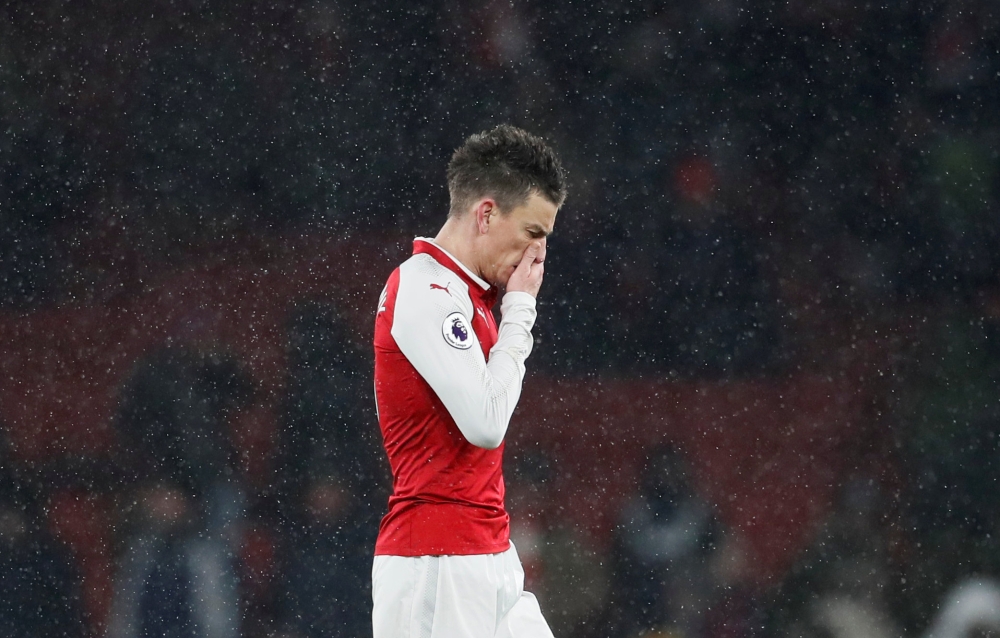 Arsenal's Laurent Koscielny looks dejected after the match REUTERS/David Klein  
