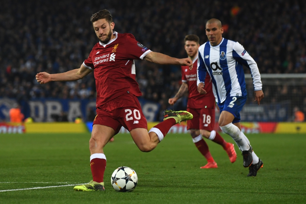 Liverpool's English midfielder Adam Lallana controls the ball during the UEFA Champions League round of sixteen second leg football match between Liverpool and FC Porto at Anfield in Liverpool, north-west England on March 6, 2018. / AFP / Paul ELLIS 
