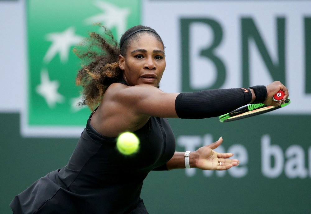  Serena Williams lunges to return a backhand to Kiki Bertens of the Netherlands during the BNP Paribas Open on March 10, 2018 at the Indian Wells Tennis Garden in Indian Wells, California. Jeff Gross/Getty Images/AFP