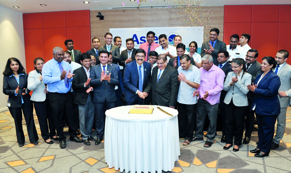 Dr Sameer Moopen, CEO of Aster DMH Qatar, Dr Nasser Moopen, Medical Director and Chief of Medical Staff and Kapil Chib, COO, with other officials and staff during the celebration to mark Aster DMH Qatar’s 15  years of healthcare in Qatar, at Holiday Inn H