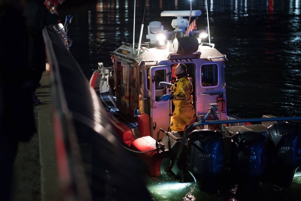 New York Fire Department boat conducts a search and rescue operation after a helicopter crashed into New York City's East River on Sunday evening that left five people dead, in New York, United States on March 12, 2018. Michael Potash - Anadolu 

