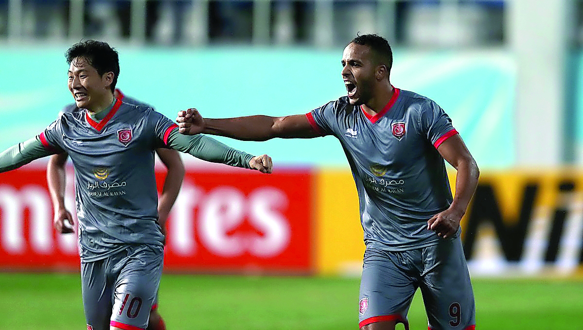 Al Duhail’s Youssef El Arabi celebrates after scoring against Lokomotiv Tashkent in the AFC Champions League match in Tashkent yesterday.
