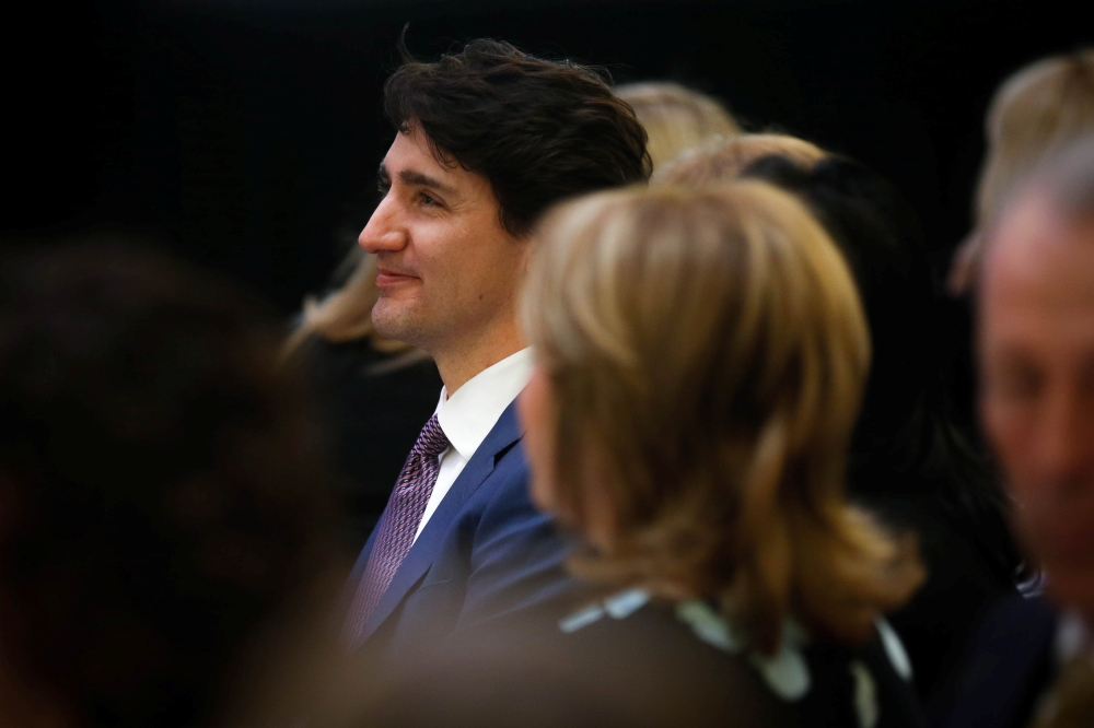 Canada's Prime Minister Justin Trudeau receives the 2018 Catalyst for Change Award and delivers remarks at the Equal Voice International Women's Day Lunch in Toronto, Ontario, Canada, March 8, 2018. REUTERS/Chris Donovan