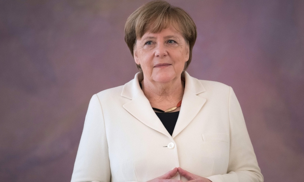 German Chancellor Angela Merkel waits to be given her certificate of appointment by the German President on March 14, 2018 at Bellevue Palace in Berlin.   AFP / Stefanie LOOS
