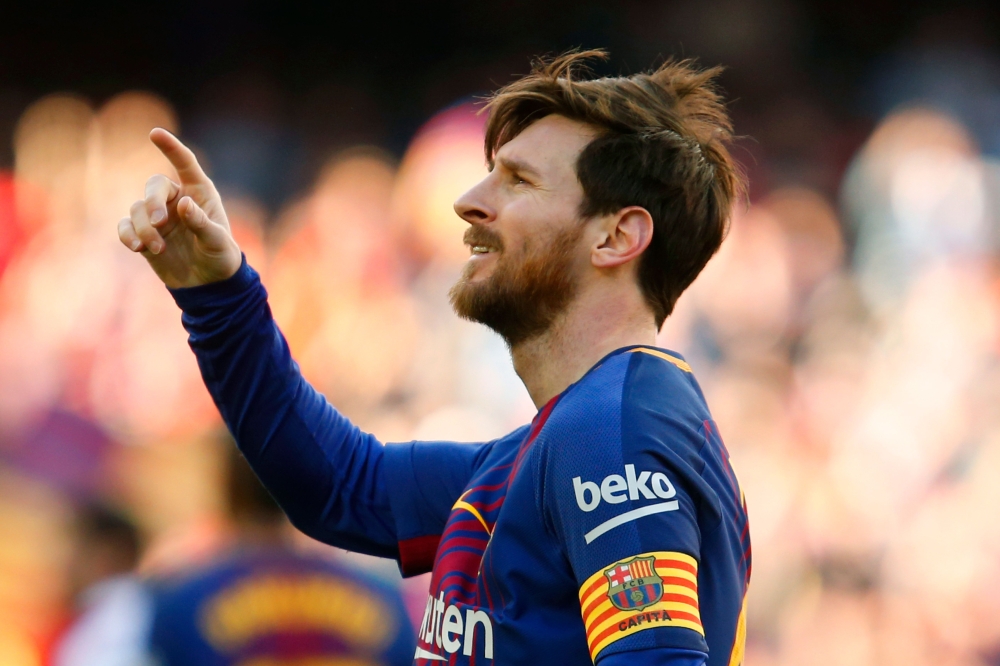 Barcelona's Argentinian forward Lionel Messi celebrates after scoring during the Spanish League football match between FC Barcelona and Athletic Club Bilbao at the Camp Nou stadium in Barcelona on March 18, 2018. / AFP / Pau Barrena
