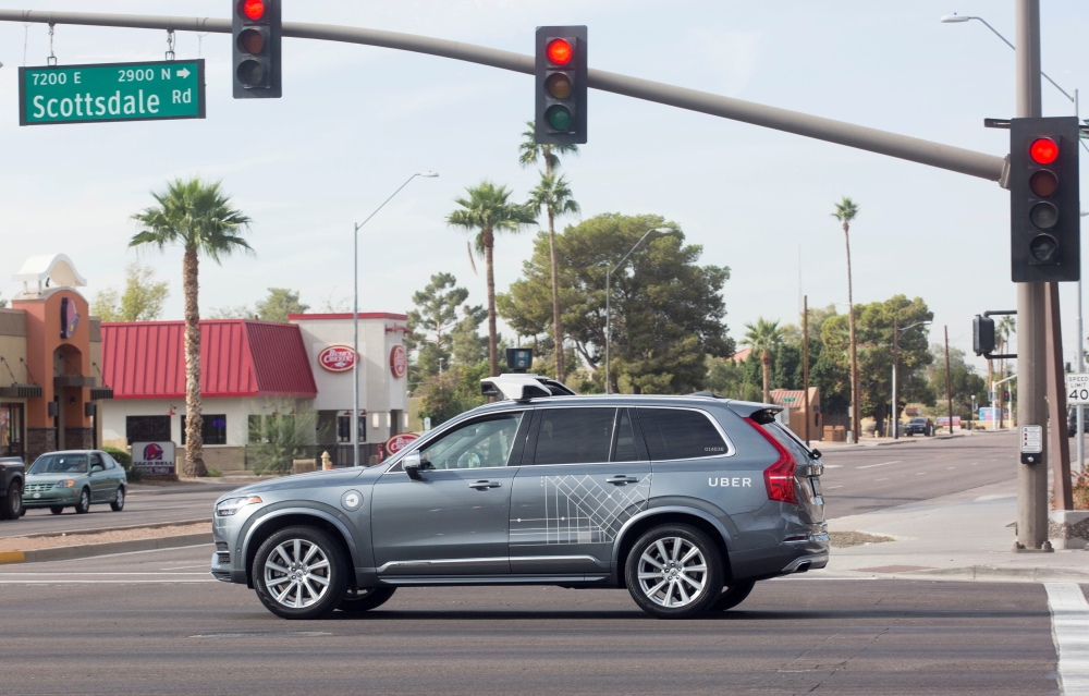 A self driving Volvo vehicle, purchased by Uber, moves through an intersection in Scottsdale, Arizona, U.S., December 1, 2017. Reuters/Natalie Behring