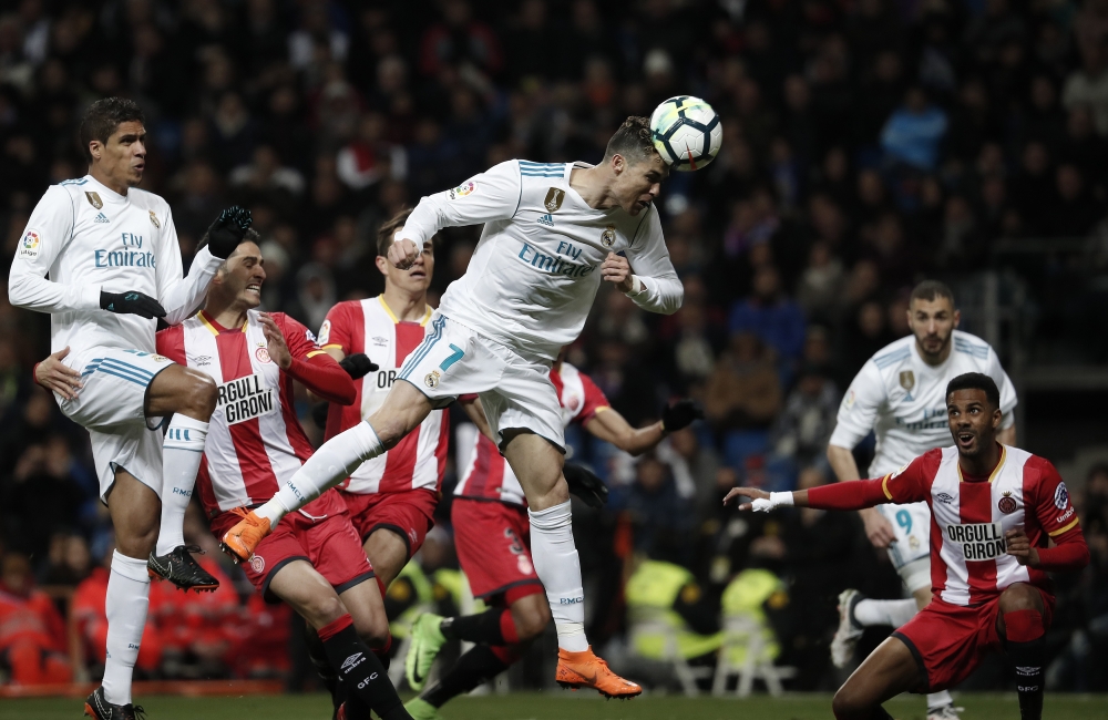 Cristiano Ronaldo of Real Madrid (C) in action during the La Liga soccer match between Real Madrid and Girona at Santiago Bernabeu Stadium in Madrid, Spain on March 18, 2018. ( Burak Akbulut - Anadolu Agency )