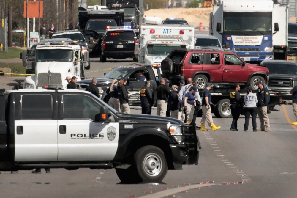 The vehicle that the Austin package bomber, Mark Anthony Conditt, was driving when he blew himself up is towed from the crime scene along Interstate 35 in suburban Austin on March 21, 2018 in Round Rock, Texas.  Scott Olson/Getty Images/AFP