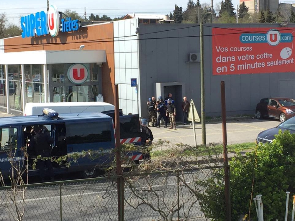 Police are seen at the scene of a hostage situation in a supermarket in Trebes, Aude, France March 23, 2018 in this picture obtained from a social media video.  La Vie A Trebes/via Reuters