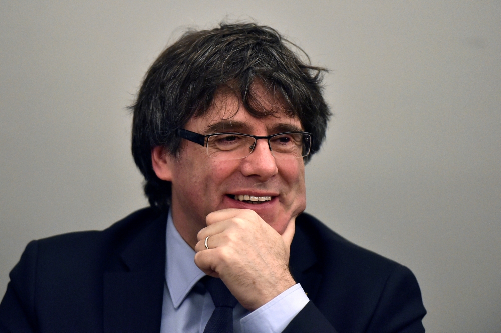 File photo of former Catalan leader Carles Puigdemont takes part in a meeting with his party in Brussels, Belgium March 14, 2018. REUTERS/Eric Vidal/File Photo