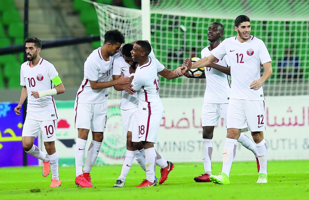 Qatar’s Abdulaziz Hatem Mohamed (third left) celebrates with team-mates after scoring a goal during their Tri-nation Friendly Tournament match played in Basra, Iraq on Saturday. 