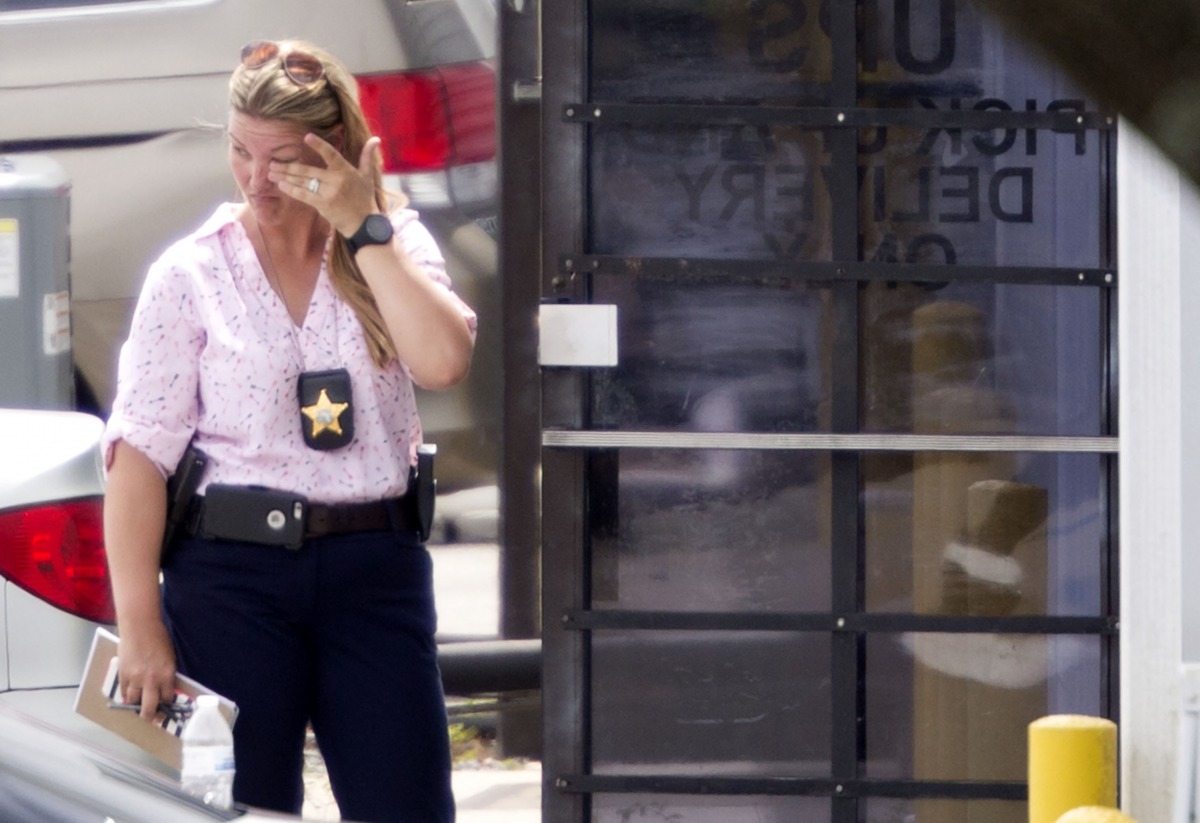 REPRESENTATIVE IMAGE: A law enforcement official wipes her eyes at the entrance to the shooting crime scene in Orlando, Florida on June 5, 2017 (AFP / Gregg Newton) 