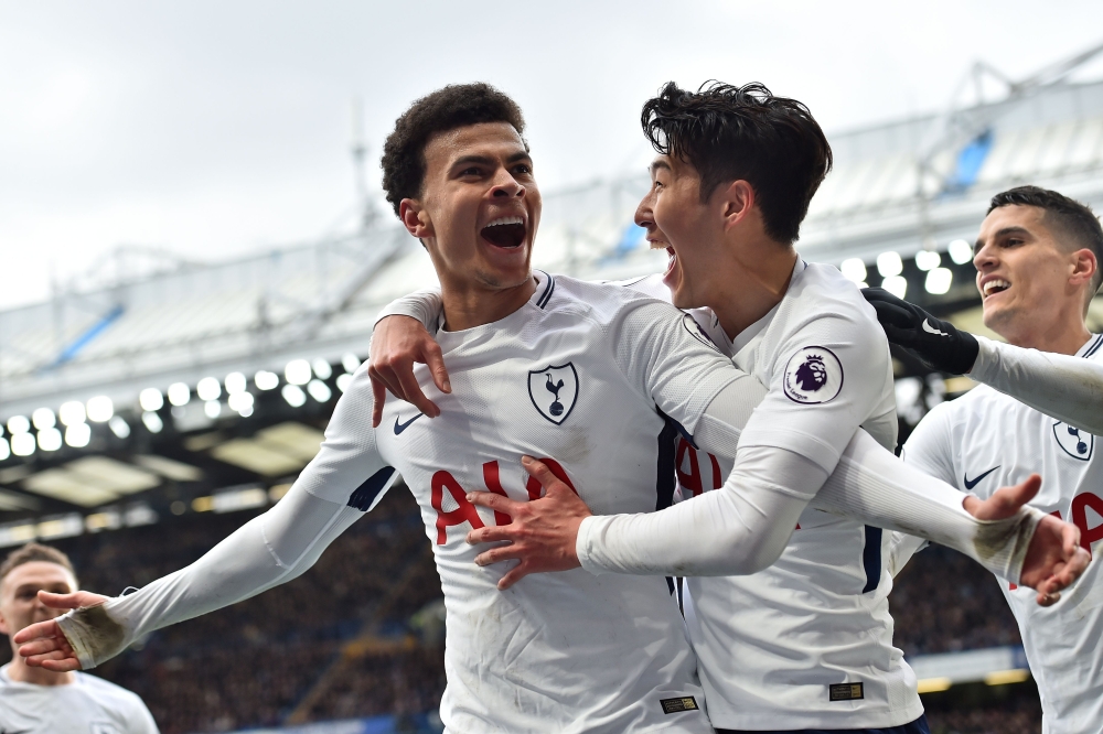 Tottenham Hotspur's English midfielder Dele Alli (L) celebrates with Tottenham Hotspur's South Korean striker Son Heung-Min after scoring their second goal during the English Premier League football match between Chelsea and Tottenham Hotspur at Stamford 