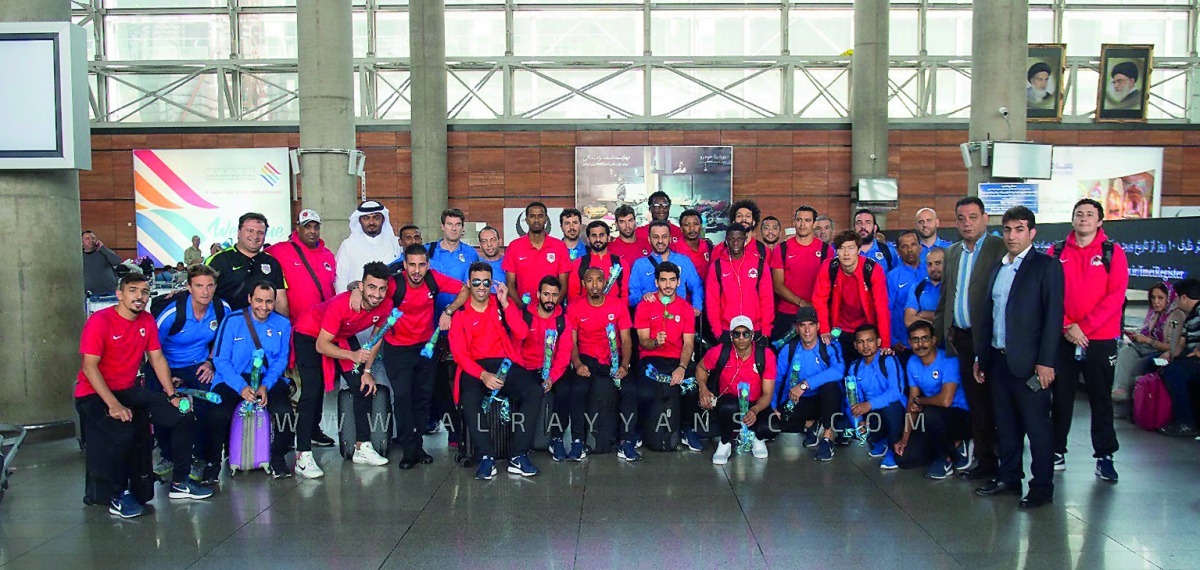 Al Rayyan players, officials and supporing staff pose for a photograph upon their arrival in Tehran on the eve of  their AFC Champions League clash against Esteghlal.