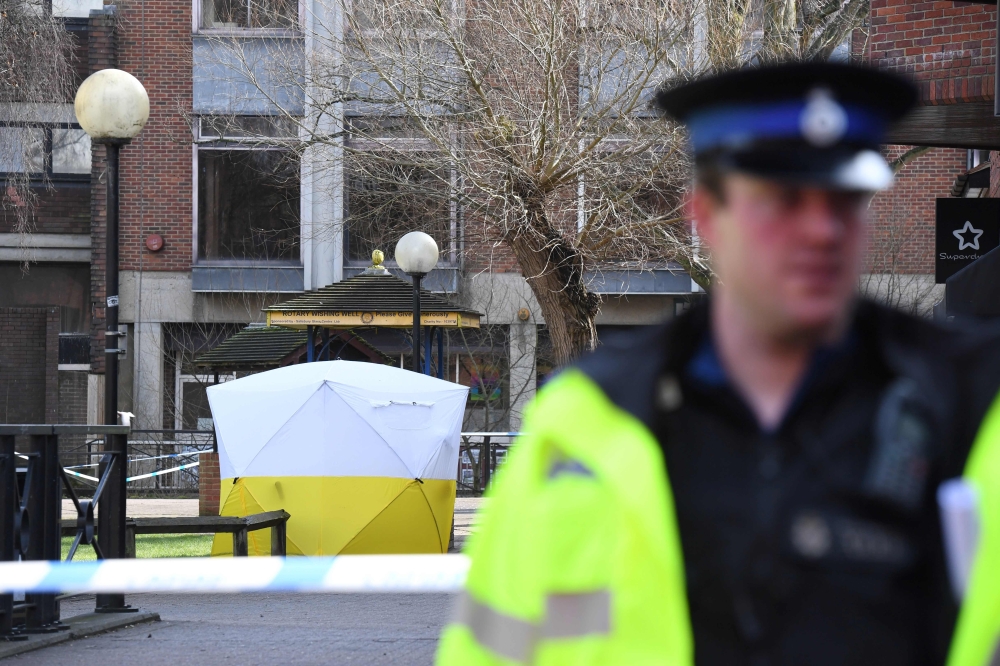(FILES) In this file photo taken on March 06, 2018 a police tent is seen behind a cordon at the scene at The Maltings shopping centre in Salisbury, southern England, where former Russian spy Sergei Skripal and his daughter Yulia were found critically ill 
