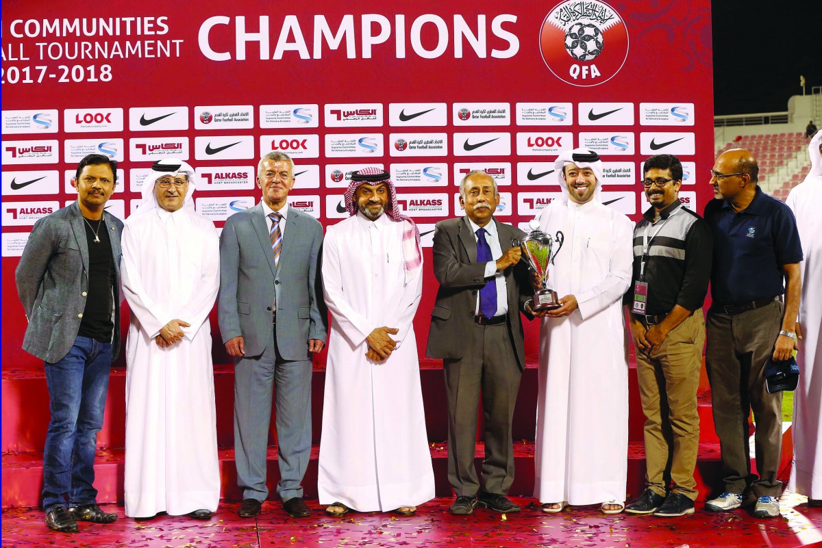 President, Indian Sports Centre, Nilangshu Dey, receiving the trophy from Khalid Al Jumaily of  Supreme Committee for Delivery and Legacy.