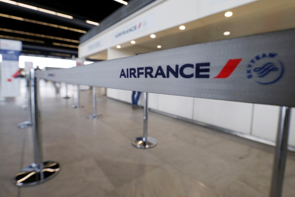Air France logo is pictured at the Air France check-in at Bordeaux-Merignac airport, as Air France pilots, cabin and ground crews unions call for a strike over salaries in Merignac near Bordeaux, France April 7, 2018. REUTERS/Regis Duvignau
