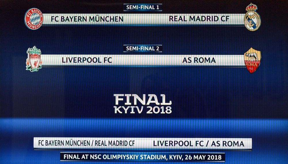 This photograph shows a screen displaying the fixtures after the draw for the semi-finals round of the UEFA Champions League football tournament at the UEFA headquarters in Nyon. (AFP / Fabrice COFFRINI)