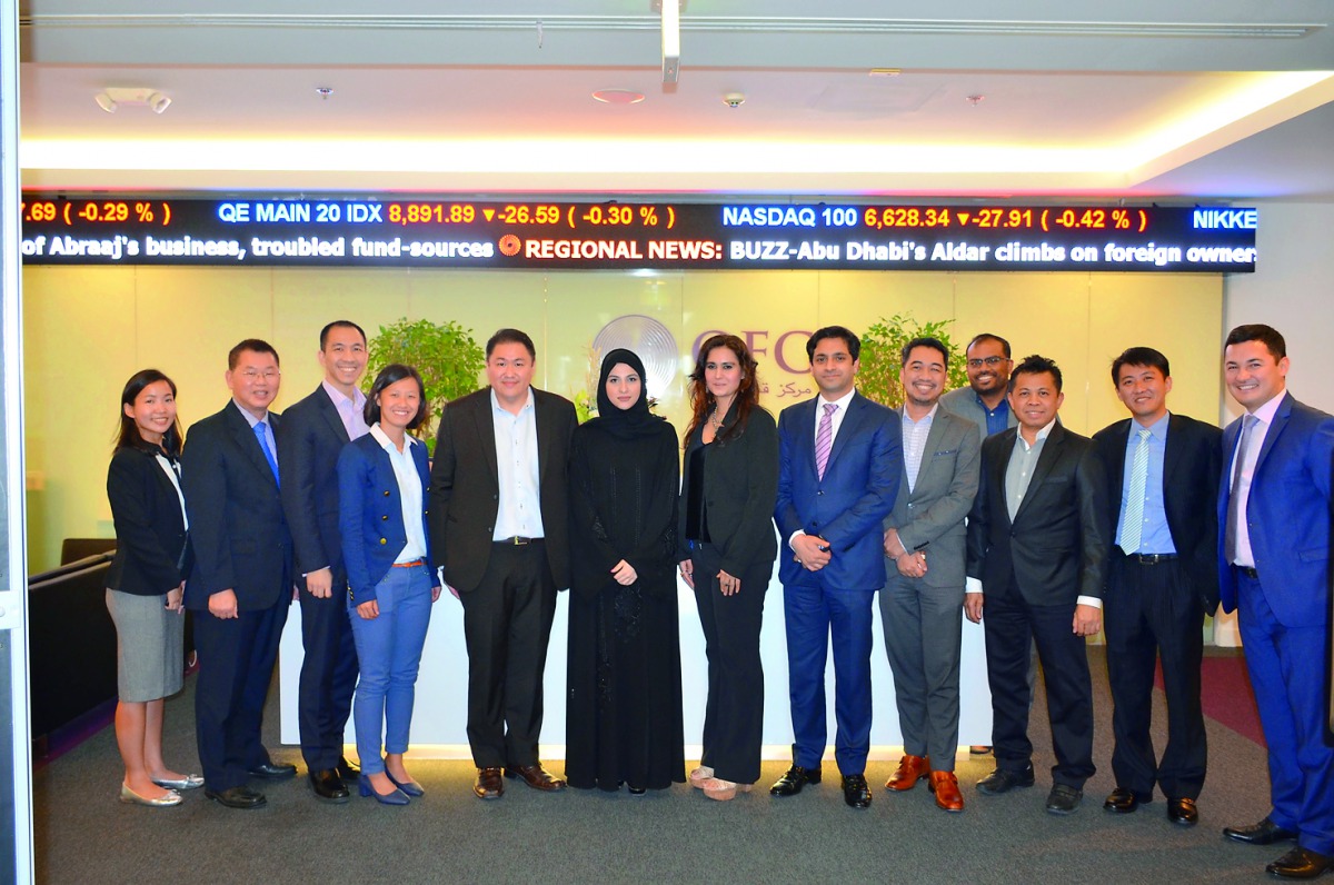 Sheikha Alanoud Hamad Al Thani (sixth left), Managing Director, Business Development, QFC Authority and other QFC officials with the vising business delegation from Singapore at QFC premises, yesterday. ? See also page 18