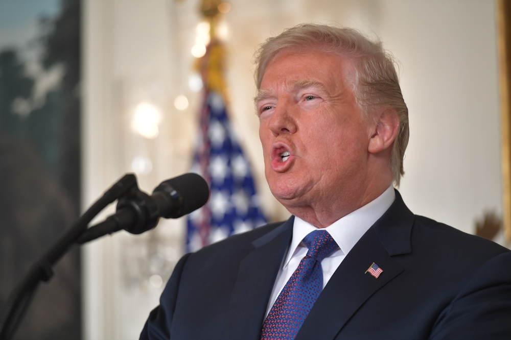 US President Donald Trump addresses the nation on the situation in Syria April 13, 2018 at the White House in Washington, DC. Trump said strikes on Syria are under way. / AFP / Mandel NGAN