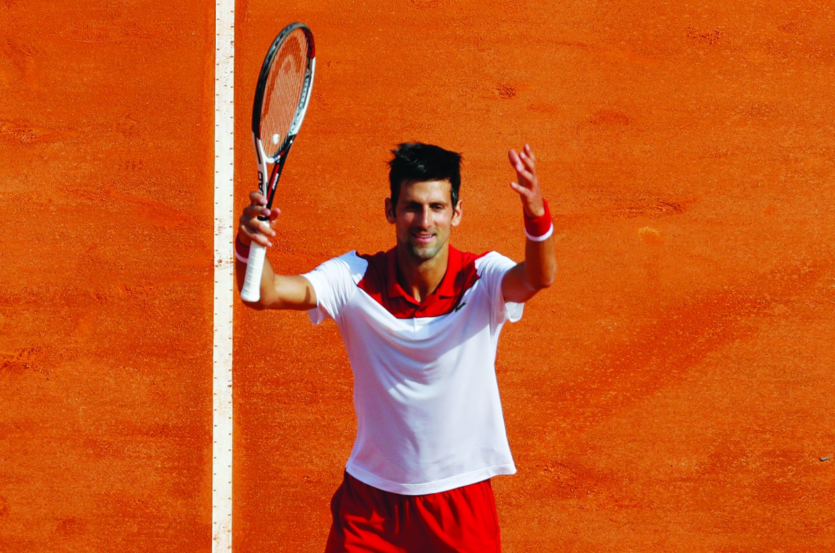Serbia's Novak Djokovic acknowledges applause as he celebrates defeating compatriot Dusan Lajovic during their round of 64 tennis match at the Monte-Carlo ATP Masters Series Tournament, on April 16, 2018 in Monaco.  AFP / Valery Hache
