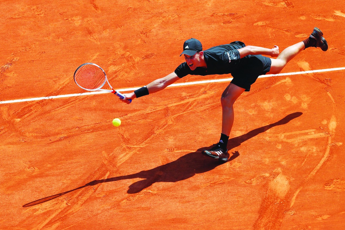 Austria's Dominic Thiem returns the ball to Russia's Andrey Rublev during their tennis match as part of the Monte-Carlo ATP Masters Series Tournament, on April 17, 2018 in Monaco. AFP / Valery Hache