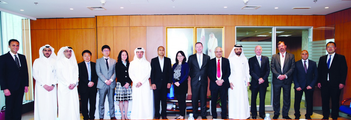 The QSE officials with the visiting delegation from Shenzhen Stock Exchange and China Merchant Securities, yesterday.