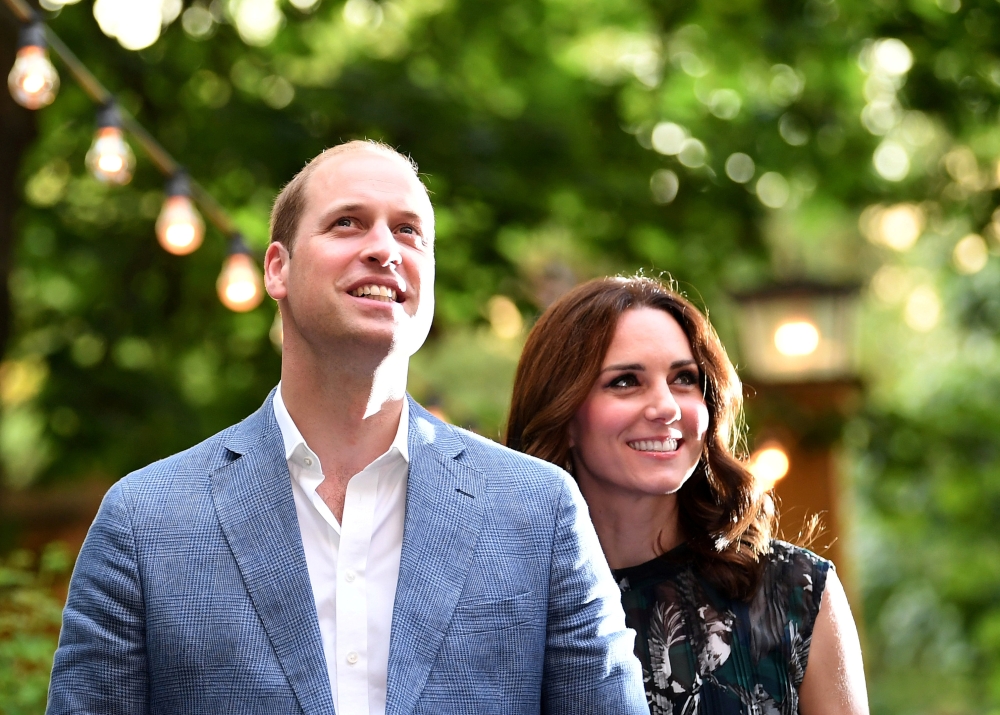FILE PHOTO: Britain's Prince William, the Duke of Cambridge and his wife Princess Kate, the Duchess of Cambridge, attend a reception at Claerchens Ballhaus, in Berlin Germany, July 20, 2017. REUTERS/Britta Pedersen/File Photo