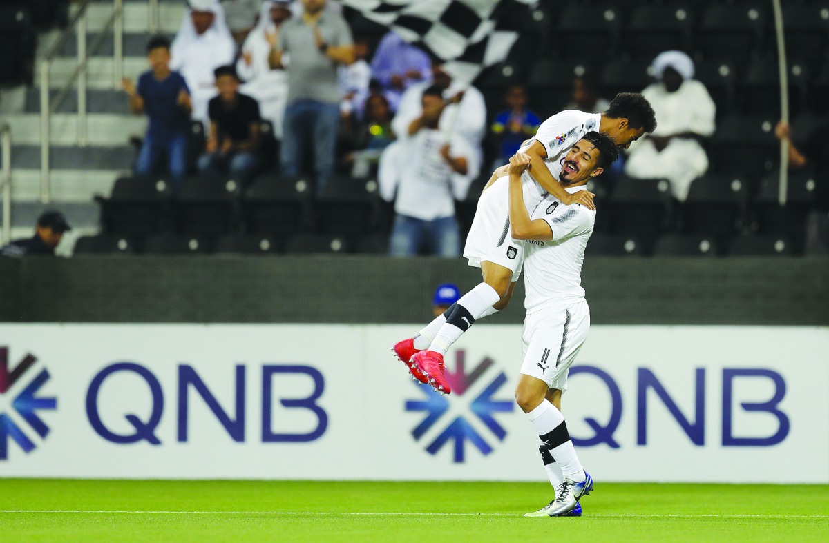 Al Sadd’s Baghdad Bounedjah and Akram Afif celebrate after scoring in this file photo.