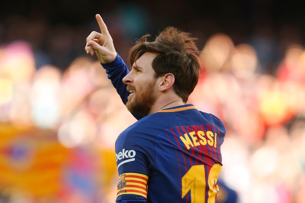 (FILES) In this file photo taken on March 18, 2018 Barcelona's Argentinian forward Lionel Messi celebrates after scoring during the Spanish League football match between FC Barcelona and Athletic Club Bilbao at the Camp Nou stadium in Barcelona on March 1