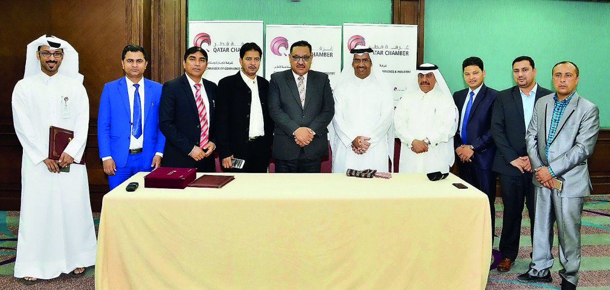 The officials posing for a group picture.