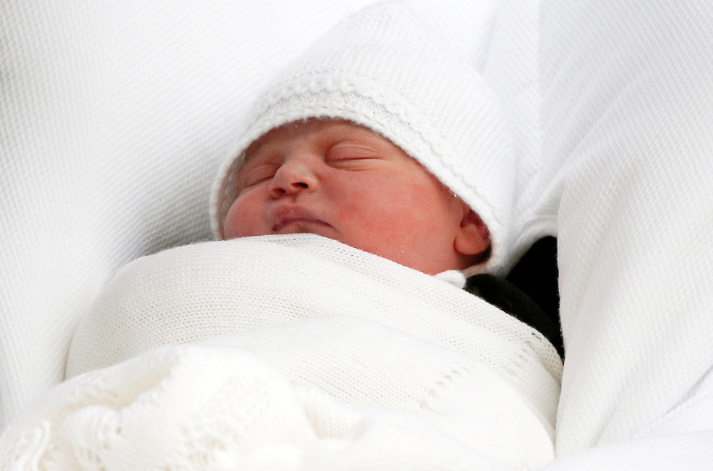 FILE PHOTO: Prince Louis of Cambridge, Louis Arthur Charles, son of Britain's Catherine, the Duchess of Cambridge and Prince William, is carried from the Lindo Wing of St Mary's Hospital in London, April 23, 2018. REUTERS/Henry Nicholls/File Photo