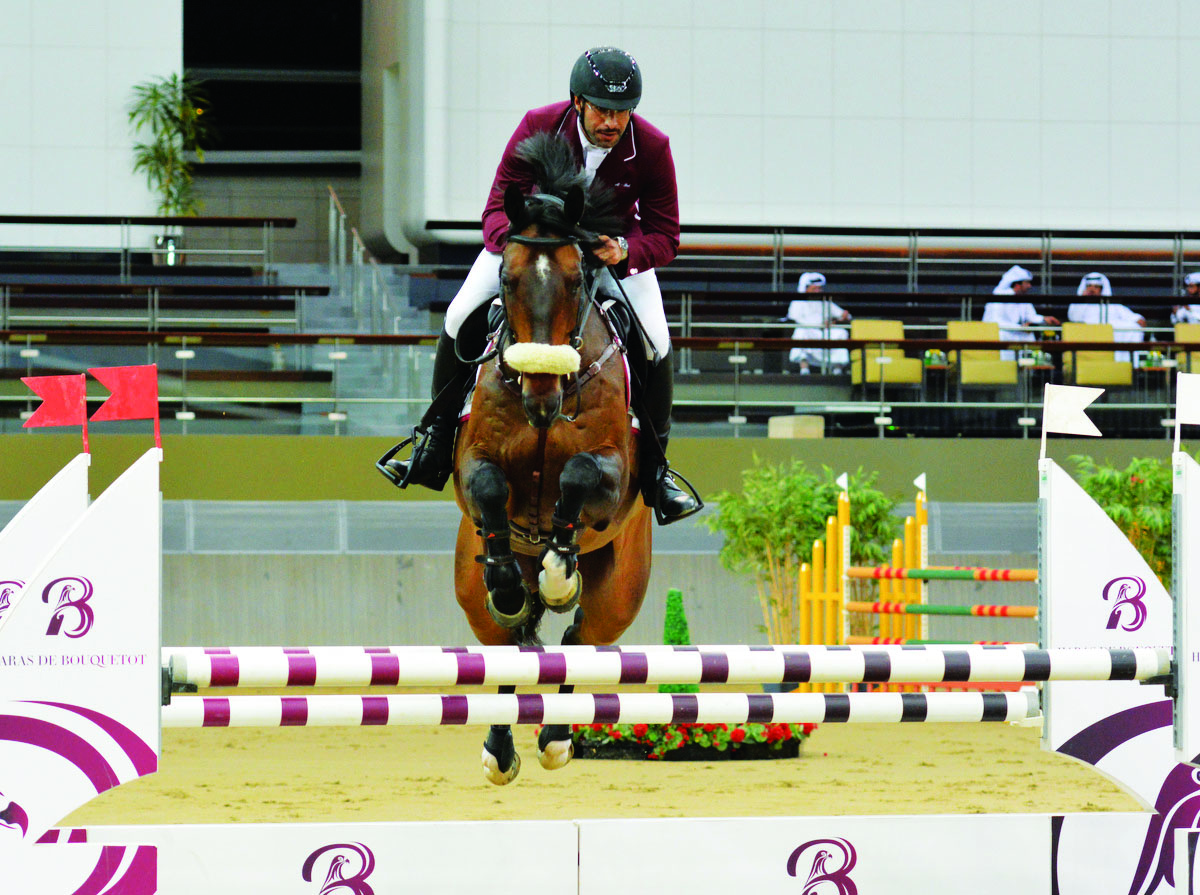 Ahmed Mohammed Al Badi guides Latino 291 over an obstacle during Round 1 of the Medium Tour of the final  leg of Hathab Equestrian Tour yesterday.
