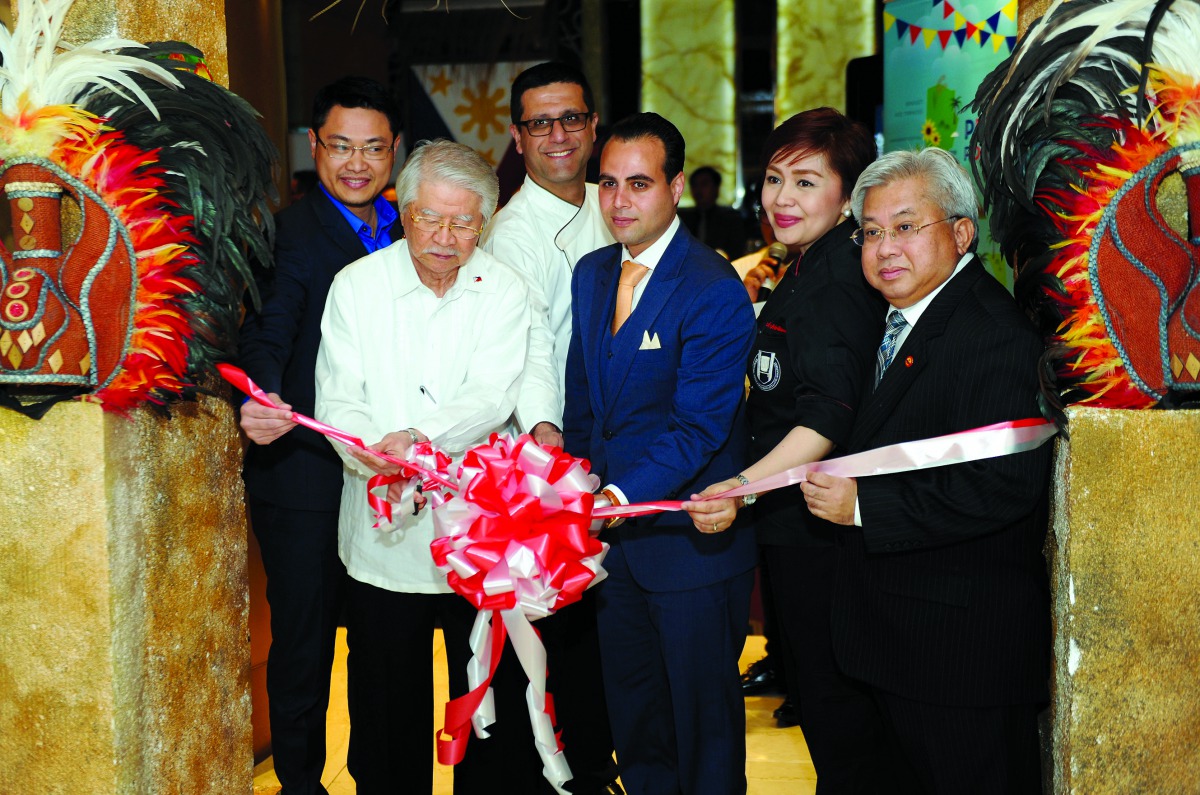 Alan L Timbayan (second left), Ambassador of the Philippines to Qatar, cutting a ribbon with Ammar Samad (third right), Hotel Manager, The Westin Doha Hotel & Spa; Chef Michelle Adrillana (second right), and other guests during the opening of the Philippi