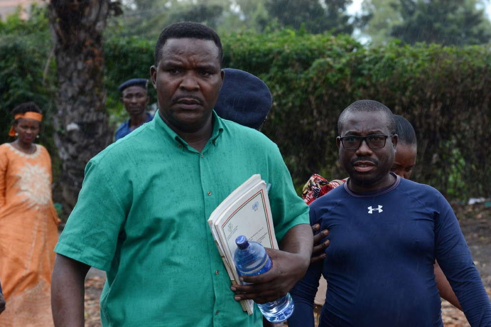 Melchiade Nzopfabarushe (L), member of Burundi's ruling National Council for the Defense of Democracy–Forces for the Defense of Democracy (CNDD-FDD) party and accused of inciting members of the ruling party to assassinate political opponents, is pictured 