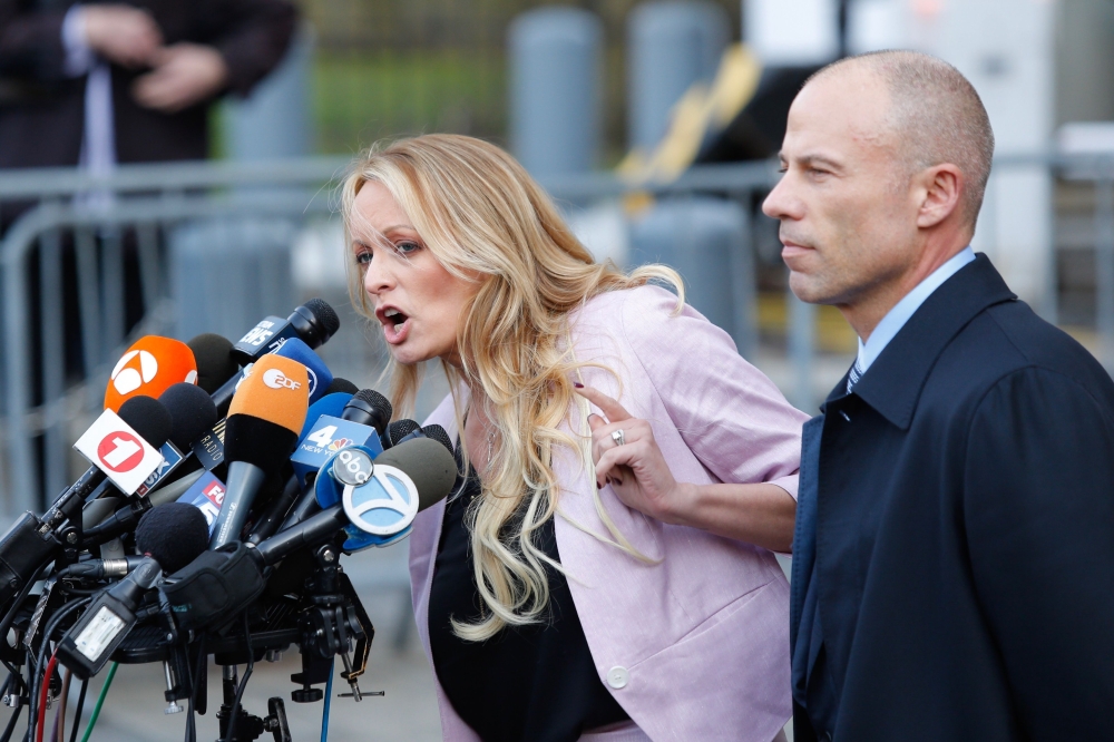 Stephanie Clifford also known as Stormy Daniels speaks outside US Federal Court with her lawyer Michael Avenatti in Lower Manhattan on April 16, 2018. (AFP / Eduardo Munoz Alvarez) 