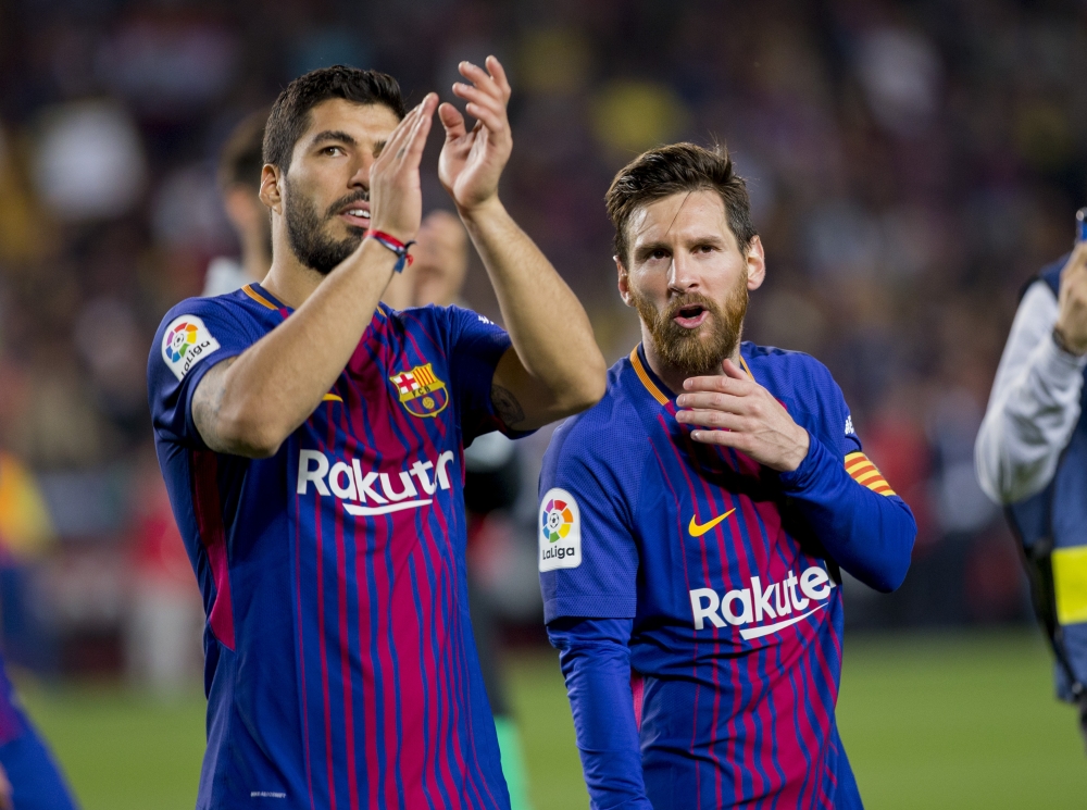 Barcelona Lionel Messi and Luis Suarez celebrate at the end of the Spanish league football match between FC Barcelona and Real Madrid CF at the Camp Nou stadium in Barcelona on May 6, 2018. ( LOLA BOU - Anadolu Agency )