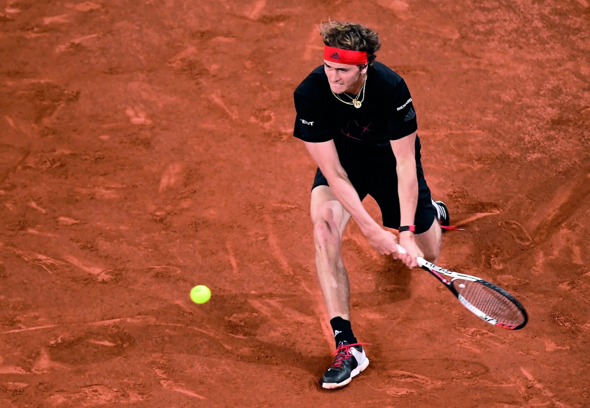 Germany's Alexander Zverev returns the ball to Canada's Denis Shapovalov during their ATP Madrid Open semi-final tennis match at the Caja Magica in Madrid on May 12, 2018. AFP / Javier Soriano