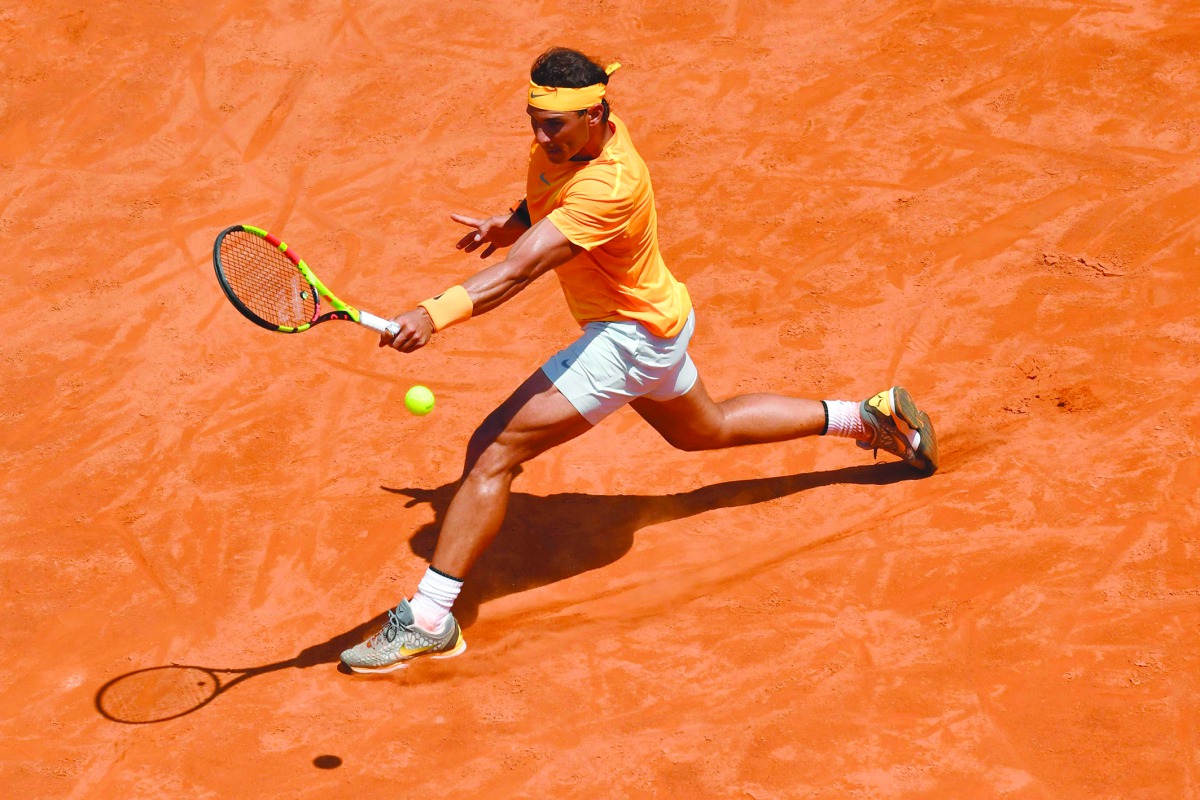 Spain's Rafael Nadal returns the ball to Italy's Fabio Fognini during Rome's ATP Tennis Open tournament at the Foro Italico, on May 18, 2018 in Rome. AFP / Andreas Solaro