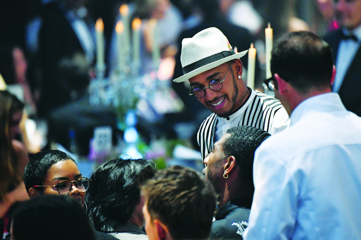 British Formula One driver Lewis Hamilton attends an auction on May 17, 2018 during the amfAR 25th Annual Cinema Against AIDS gala at the Hotel du Cap-Eden-Roc in Cap d'Antibes, southern France, during the 71th Cannes Film Festival. AFP / Alberto Pizzoli