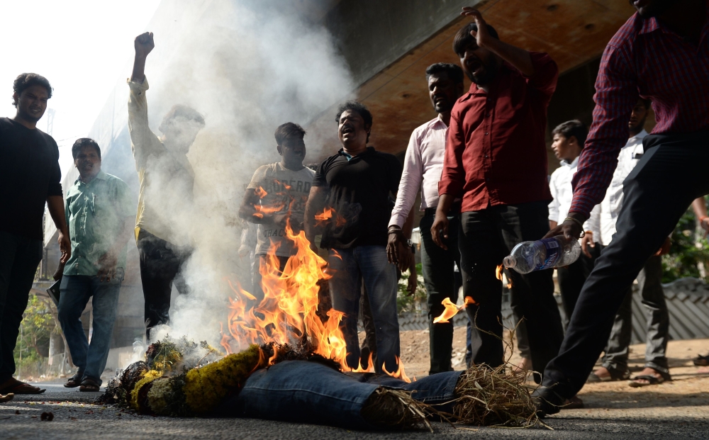Indian protesters burn an effigy of Vedanta Resources Executive Chairman Anil Agarwal during a protest in Chennai on May 22, 2018, condemning the killings of protesters during a demonstration in the south Indian city of Tuticorin held to demand the closur