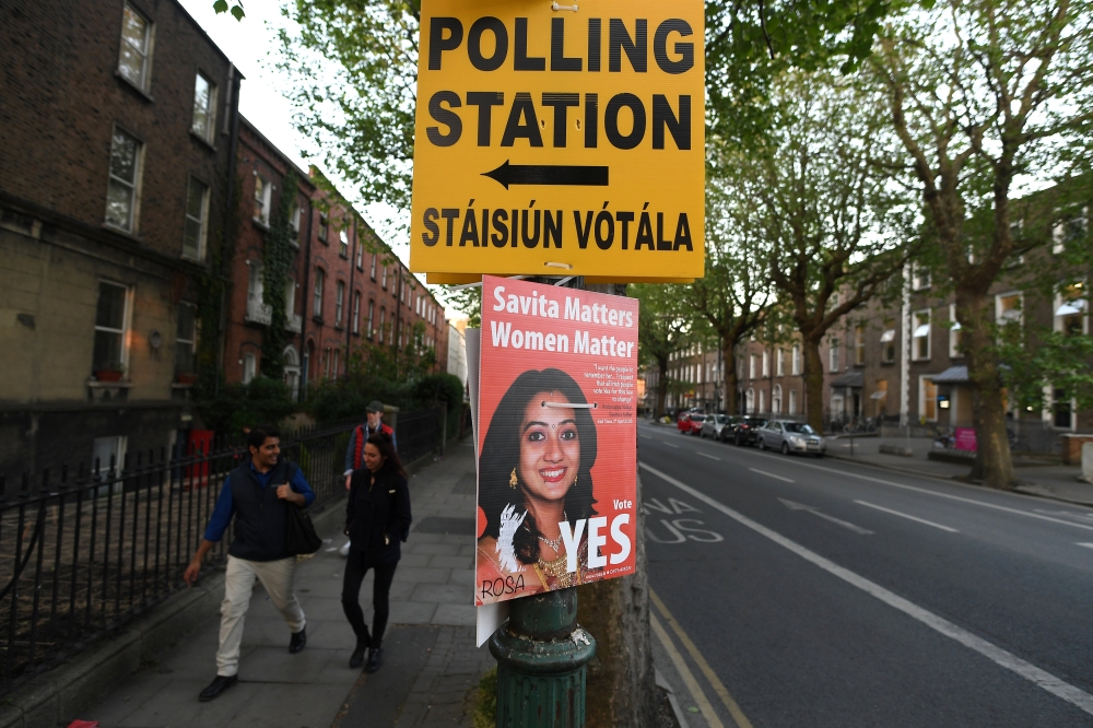 A Pro-Choice poster featuring Savita Halappanavar is placed near a sign for a polling station ahead of a 25th May referendum on abortion law, in Dublin, Ireland May 23, 2018. Reuters/Clodagh Kilcoyne
