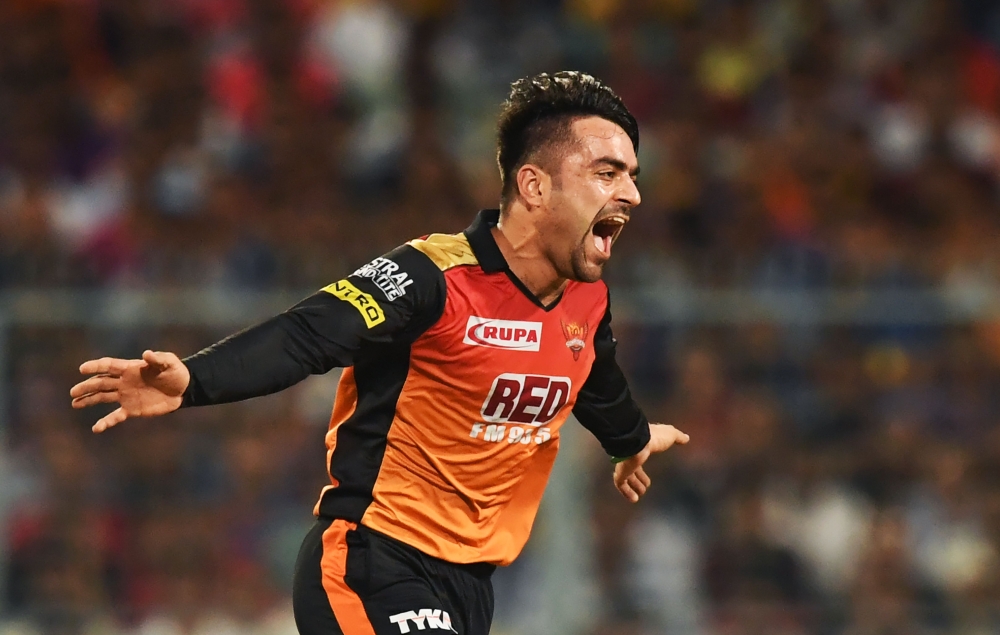 (FILES) In this photograph taken on May 25, 2018 Sunrisers Hyderabad cricketer Rashid Khan celebrates after taking the wicket of Kolkata Knight Riders cricketer Andre Russell during the 2018 Indian Premier League(IPL) Twenty20 second Qualifier cricket mat