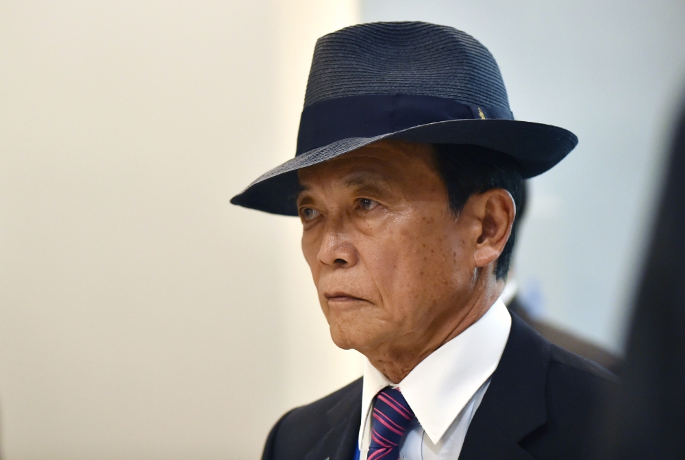 (FILES) In this file photo taken on May 19, 2016, Japan's Finance Minister Taro Aso arrives at a welcome reception hosted by the City of Sendai in Sendai. AFP / Kazuhiro NOGI