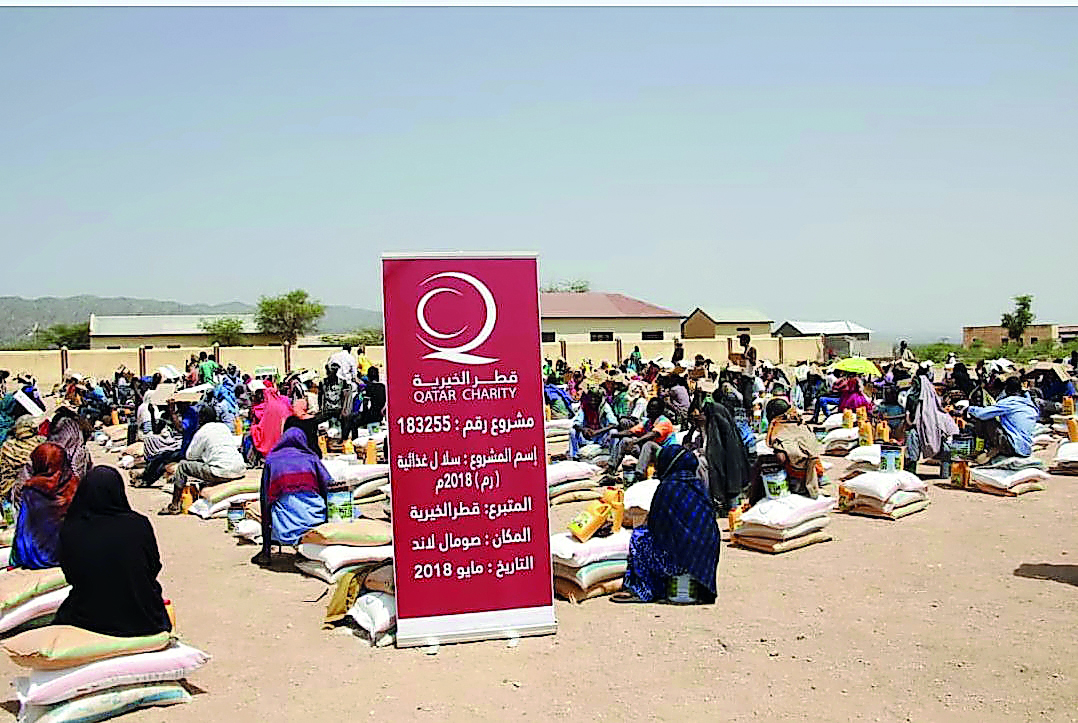 The affected people along with the food baskets in Somalia.